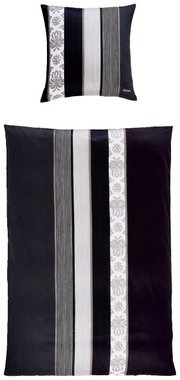 Bettwäsche-Set mit Kissen und Decke in Schwarz-Weiß mit Streifen- und Blumenmuster, von oben betrachtet.