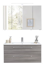 Moderne Badkombination mit Spiegelschrank und Waschbeckenunterschrank in Holzoptik, frontal betrachtet.