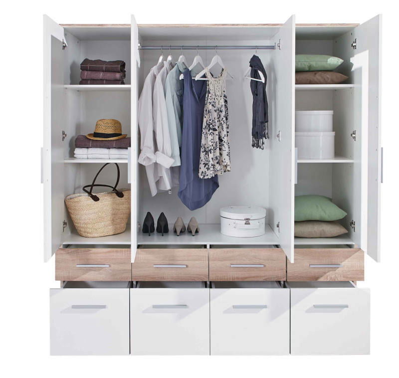 Offener 4-türiger Drehtürenschrank mit hängender Kleidung, Regalen und Schubladen, frontal betrachtet.