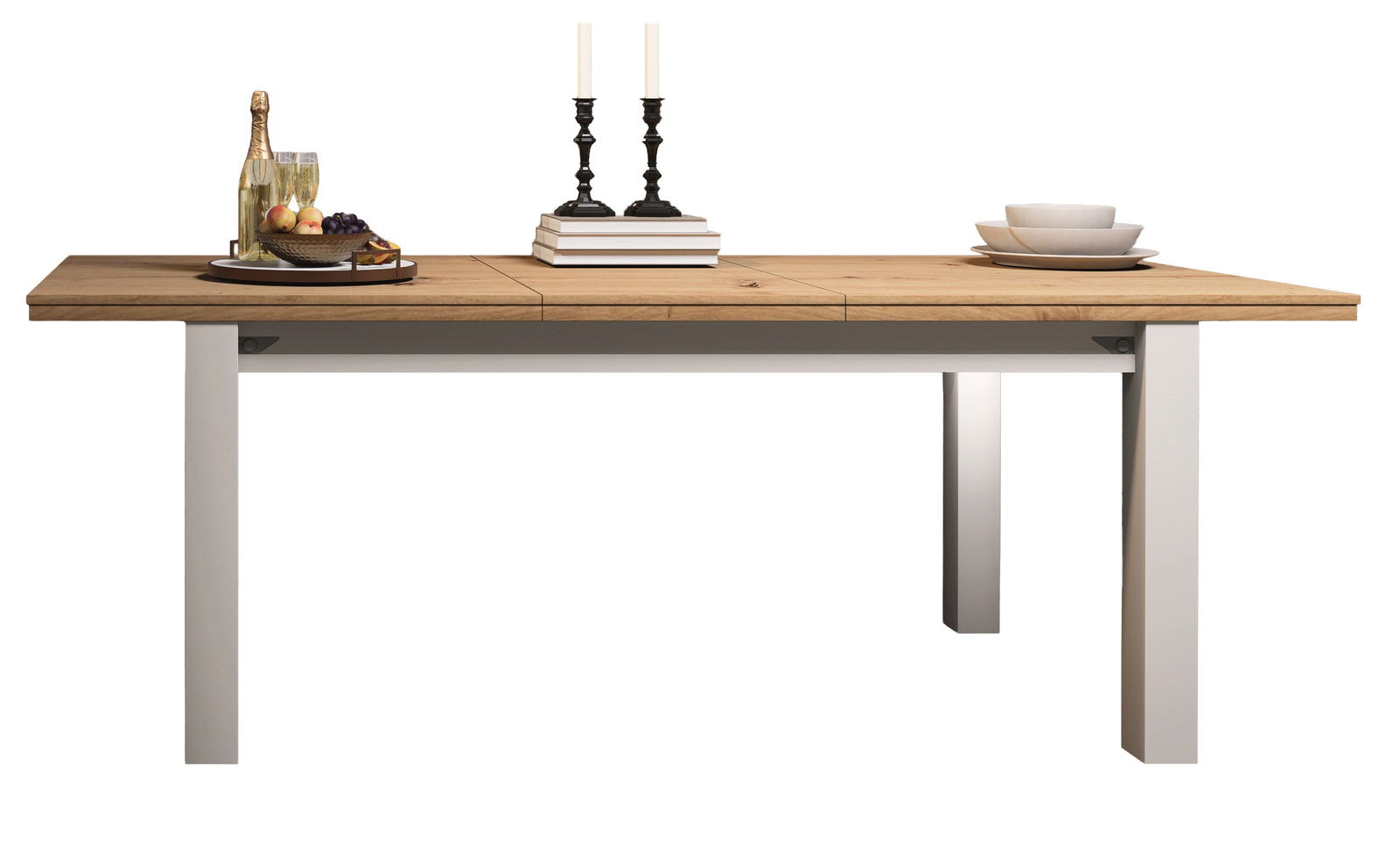 Moderner Esstisch mit Holzplatte und weißen Beinen, dekoriert mit Kerzen, Büchern und Geschirr, seitliche Perspektive.