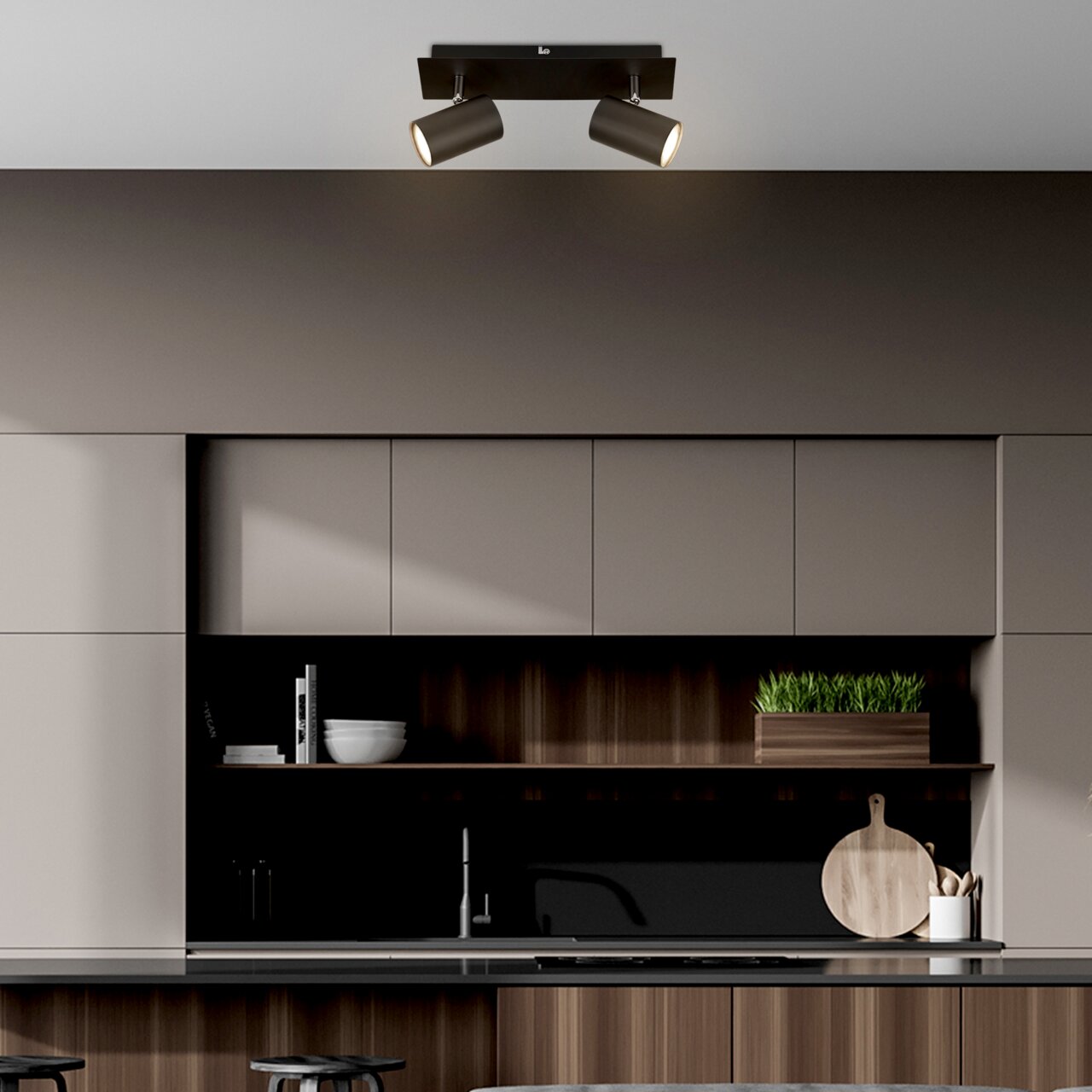 Moderne led-plafondlamp met twee verstelbare spots in een stijlvolle keuken, gezien van onderaf.