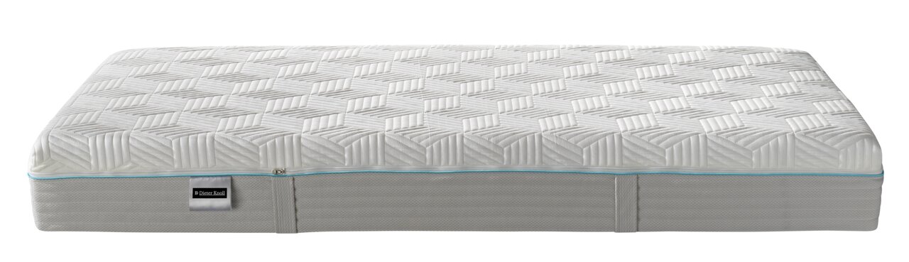 Seitliche Ansicht einer Dieter Knoll Gel-Kaltschaummatratze mit geometrischem Muster und blauer Ziernaht.