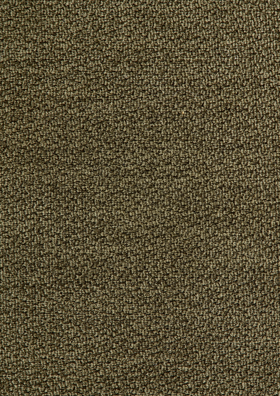 Nahaufnahme eines strukturierten, olivgrünen Stoffes, verwendet für Longchairkombination.