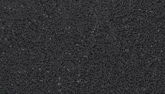 Nahaufnahme der Oberfläche eines Couchtischs mit dunkler, texturierter Struktur.