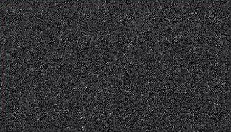 Nahaufnahme der Oberfläche eines Couchtischs mit dunkler, texturierter Struktur.