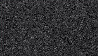 Nahaufnahme der Oberfläche eines Couchtischs mit dunkler, texturierter Struktur.