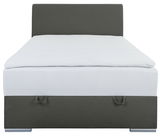 Boxbett 120 in grauer Farbe, frontal fotografiert mit Kopfteil und Stauraum.