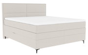 Boxspringbett in seitlicher Perspektive mit hellem Stoffbezug und schlichtem Design.