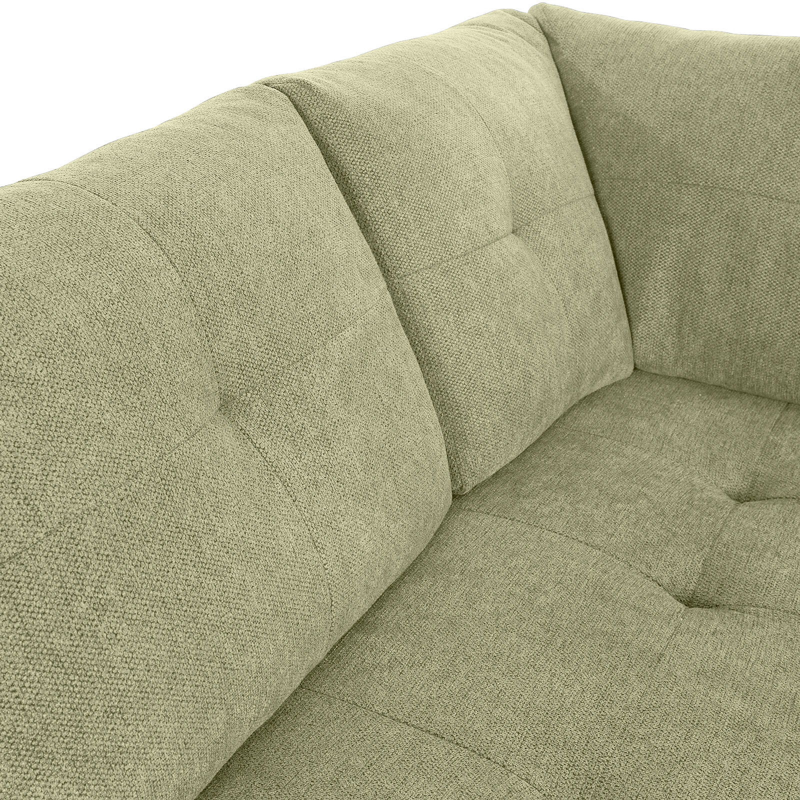 Nahaufnahme einer grünen Sofaecke mit gepolsterten Kissen und strukturierter Oberfläche, Perspektive von oben.