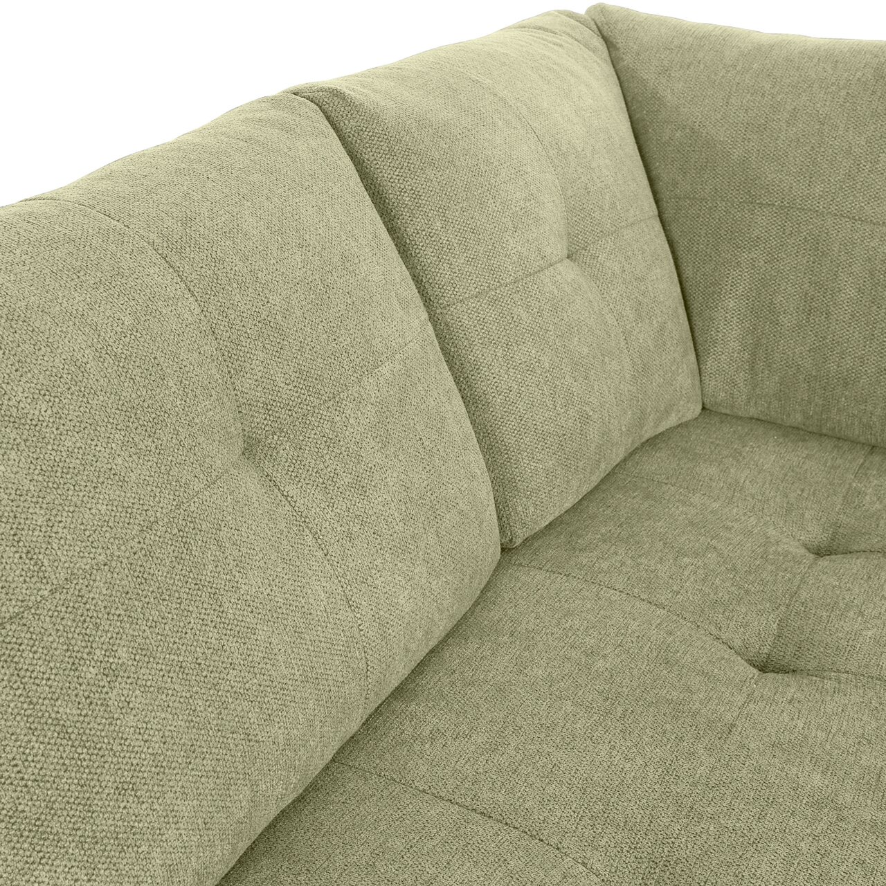 Nahaufnahme einer grünen Sofaecke mit gepolsterten Kissen und strukturierter Oberfläche, Perspektive von oben.