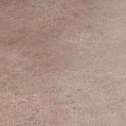 Nahaufnahme der Textur eines Schwingstuhlsitzes in beige.