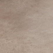 Nahaufnahme der Textur eines Schwingstuhlsitzes in beige.