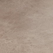 Nahaufnahme der Textur eines Schwingstuhlsitzes in beige.