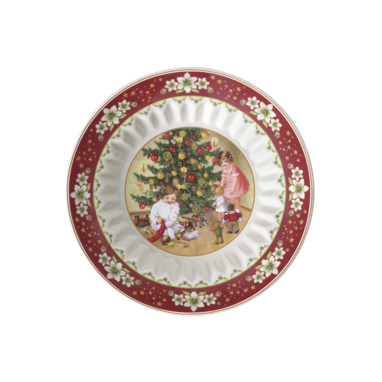 Kleine Schale mit weihnachtlichem Motiv von spielenden Kindern vor einem Weihnachtsbaum, aus der Vogelperspektive betrachtet.