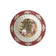 Kleine Schale mit weihnachtlichem Motiv von spielenden Kindern vor einem Weihnachtsbaum, aus der Vogelperspektive betrachtet.