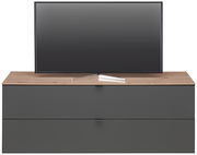 TV-Lowboard DIANA in Frontansicht mit Holzoberfläche und dunklen Schubladen, darauf steht ein Flachbildfernseher.