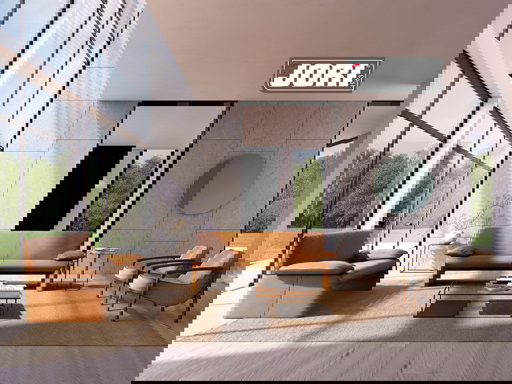 Elegantes JORI-Wohnzimmer mit Ledersofas.