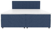 Blaues Boxspringbett mit gepolstertem, quadratisch abgestepptem Kopfteil und weißer Matratzenauflage, frontal von vorn fotografiert.