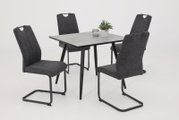 Vier graue Schwingstühle um einen quadratischen Tisch mit schwarzem Gestell, seitliche Perspektive.
