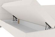 Boxspringbett mit geöffnetem Stauraum, seitliche Perspektive