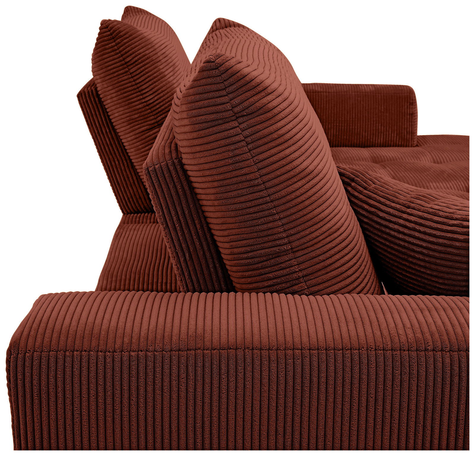 Nahaufnahme einer roten, gerippten Sofaecke mit zwei großen Kissen, seitliche Perspektive.