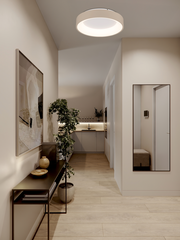 Moderne LED-Deckenleuchte in einem stilvollen Flur, von unten betrachtet.