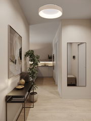 Moderne LED-Deckenleuchte in einem stilvollen Flur, von unten betrachtet.