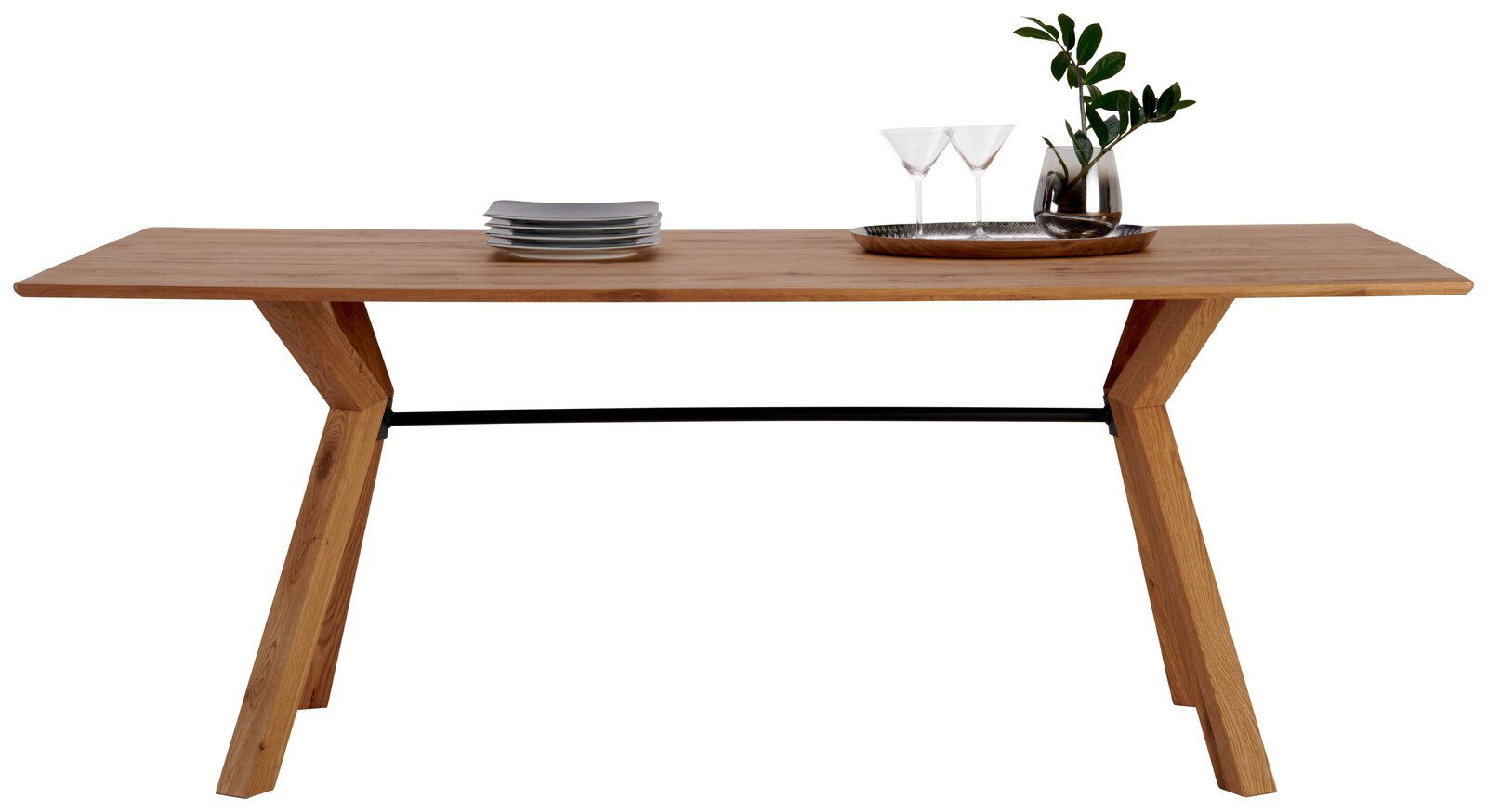 Dieter Knoll Esstisch MONDELLO Moderner Esstisch aus Holz mit schrägen Beinen, seitliche Perspektive, dekoriert mit Geschirr und Pflanzen.