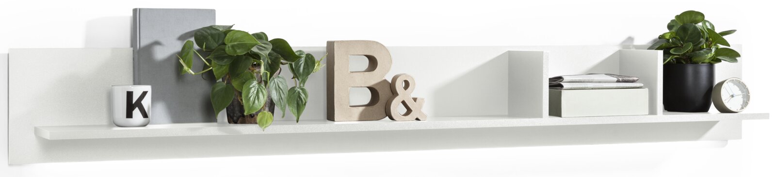 Set one by Musterring Wandboard TACOMA Weißes Wandboard mit Dekorationen wie Pflanzen, Büchern und einer Uhr, seitliche Perspektive