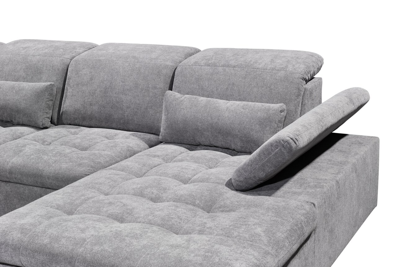 Graues Ecksofa mit verstellbarer Rückenlehne und Kissen, seitliche Perspektive