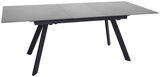 Moderner Esstisch mit grauer Tischplatte und schwarzen, schrägen Beinen, seitliche Perspektive