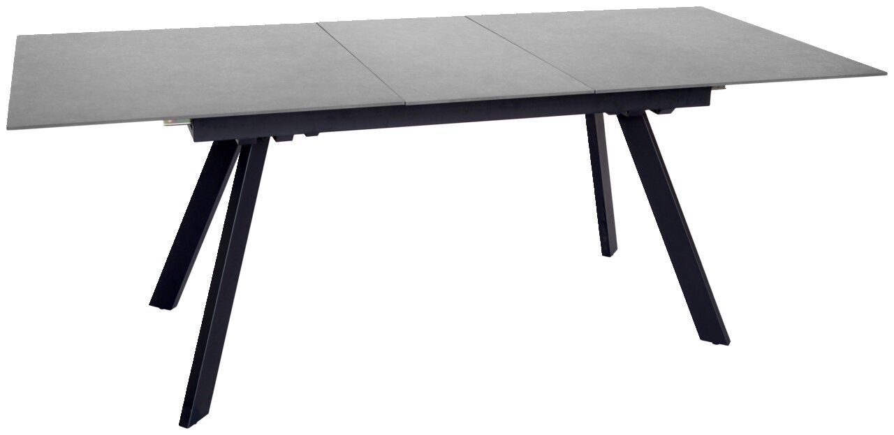 Moderner Esstisch mit grauer Tischplatte und schwarzen, schrägen Beinen, seitliche Perspektive