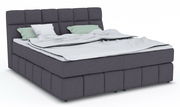 Boxspringbett DOWNTOWN in dunklem Stoffbezug mit hohem Kopfteil, seitliche Perspektive