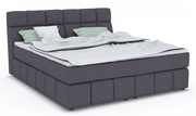 Boxspringbett DOWNTOWN in dunklem Stoffbezug mit hohem Kopfteil, seitliche Perspektive