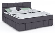 Boxspringbett DOWNTOWN in dunklem Stoffbezug mit hohem Kopfteil, seitliche Perspektive