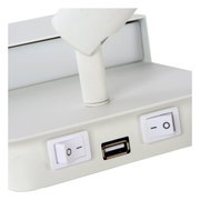 Close-up van een witte wand- of bedlamp met twee schakelaars en een USB-aansluiting, gezien vanaf de zijkant.