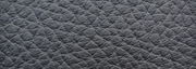 Nahaufnahme der texturierten Oberfläche eines Sessels in dunkler Farbe, diagonale Perspektive.