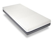 Viskomat-matras in schuin perspectief, met een witte, gestructureerde hoes en een grijze rand.