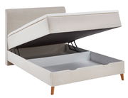 Boxspringbett mit hochgeklappter Matratze und Stauraum, seitliche Perspektive