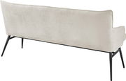 Rückansicht einer modernen, cremefarbenen Bank mit schwarzen Metallbeinen.
