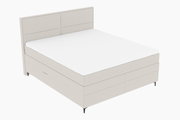 Boxspringbett in seitlicher Perspektive mit hellem Stoffbezug und schlichtem Design