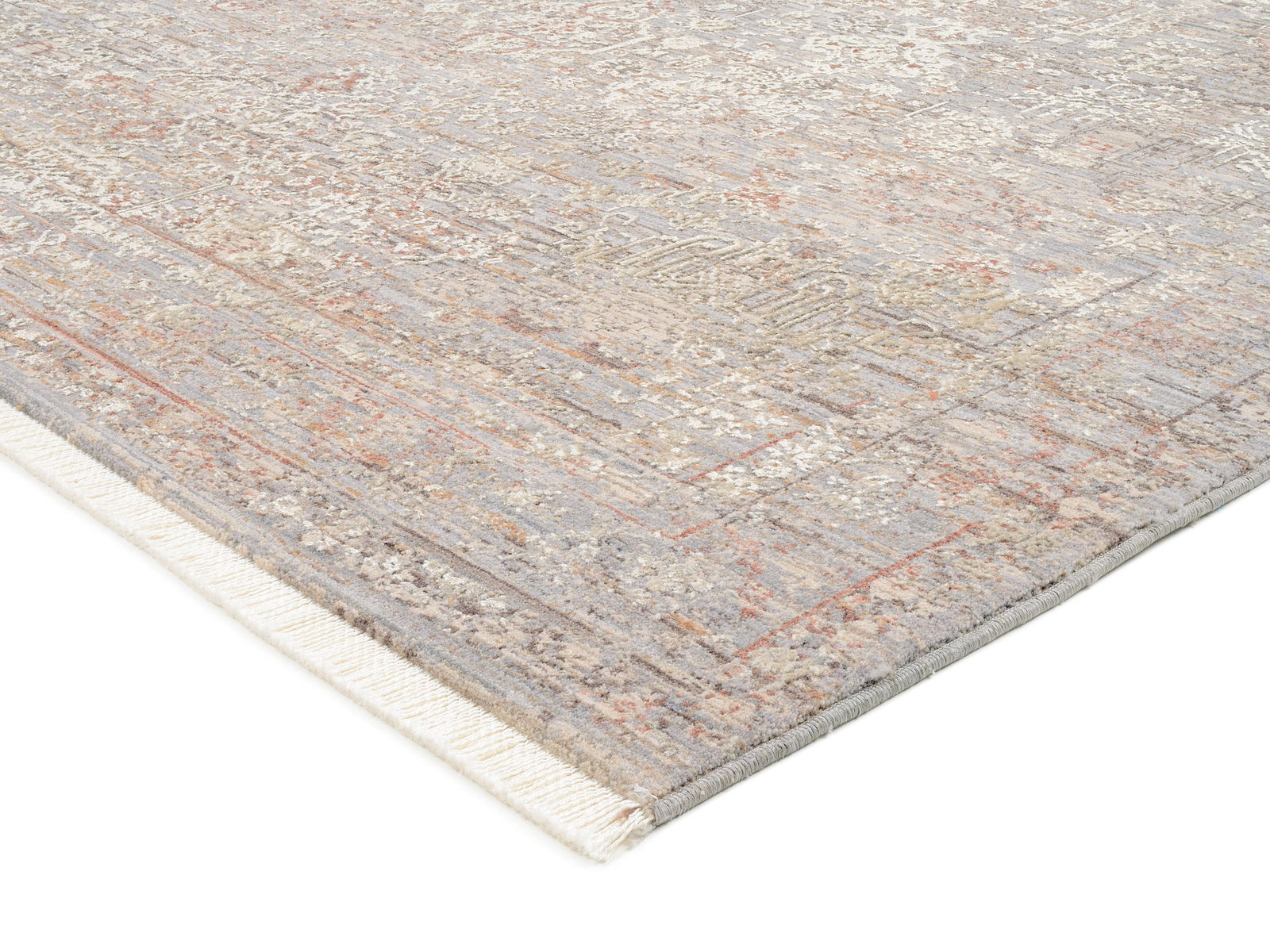 Designer Teppich in sanften Beige- und Grautönen mit subtilen Mustern, perspektivisch von der Seite aufgenommen.