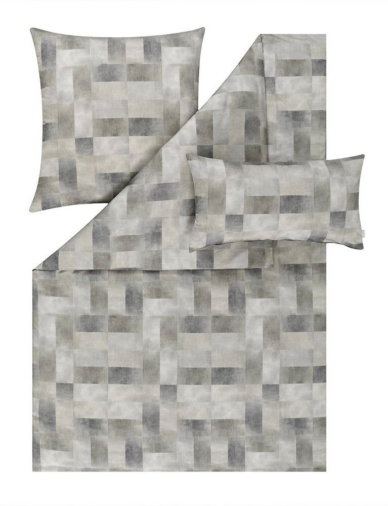 Bettwäsche-Set mit geometrischem Muster in Grautönen, bestehend aus einem Kissenbezug und einem Bettdeckenbezug, aus der Vogelperspektive fotografiert.