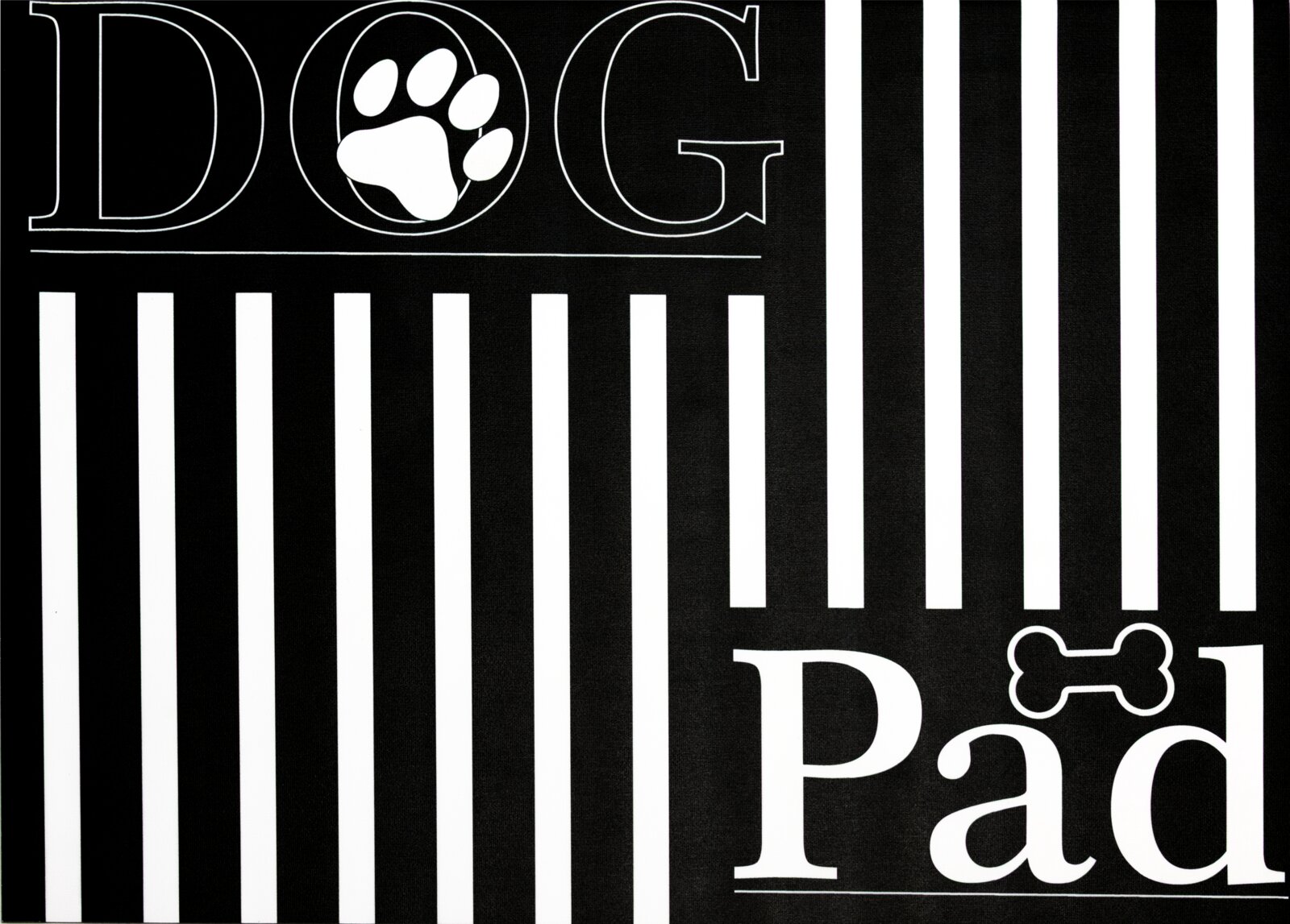 Stuco Voerbakmat DOG PAD Zwart-witte voerbakmat met de opschriften 'DOG' en 'Pad', versierd met een pootafdruk en een botmotief, gezien vanuit vogelperspectief.
