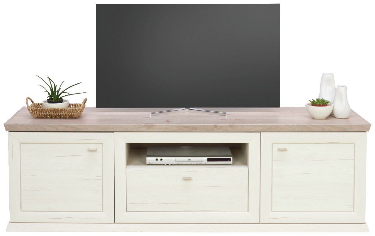 Vooraanzicht van een tv-lowboard uit de Camron/Benton-serie met een lichte houten afwerking, twee deuren, een open vak met dvd-speler en decoratieve elementen aan de bovenkant.