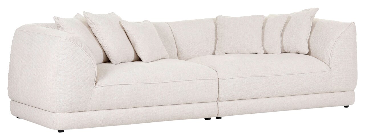 Beige grote bank met verschillende kussens, zijaanzicht
