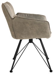 Seitenansicht eines drehbaren Armlehnstuhls der Serie FRISCO von Musterring mit schwarzem Metallgestell und grauem Polster.