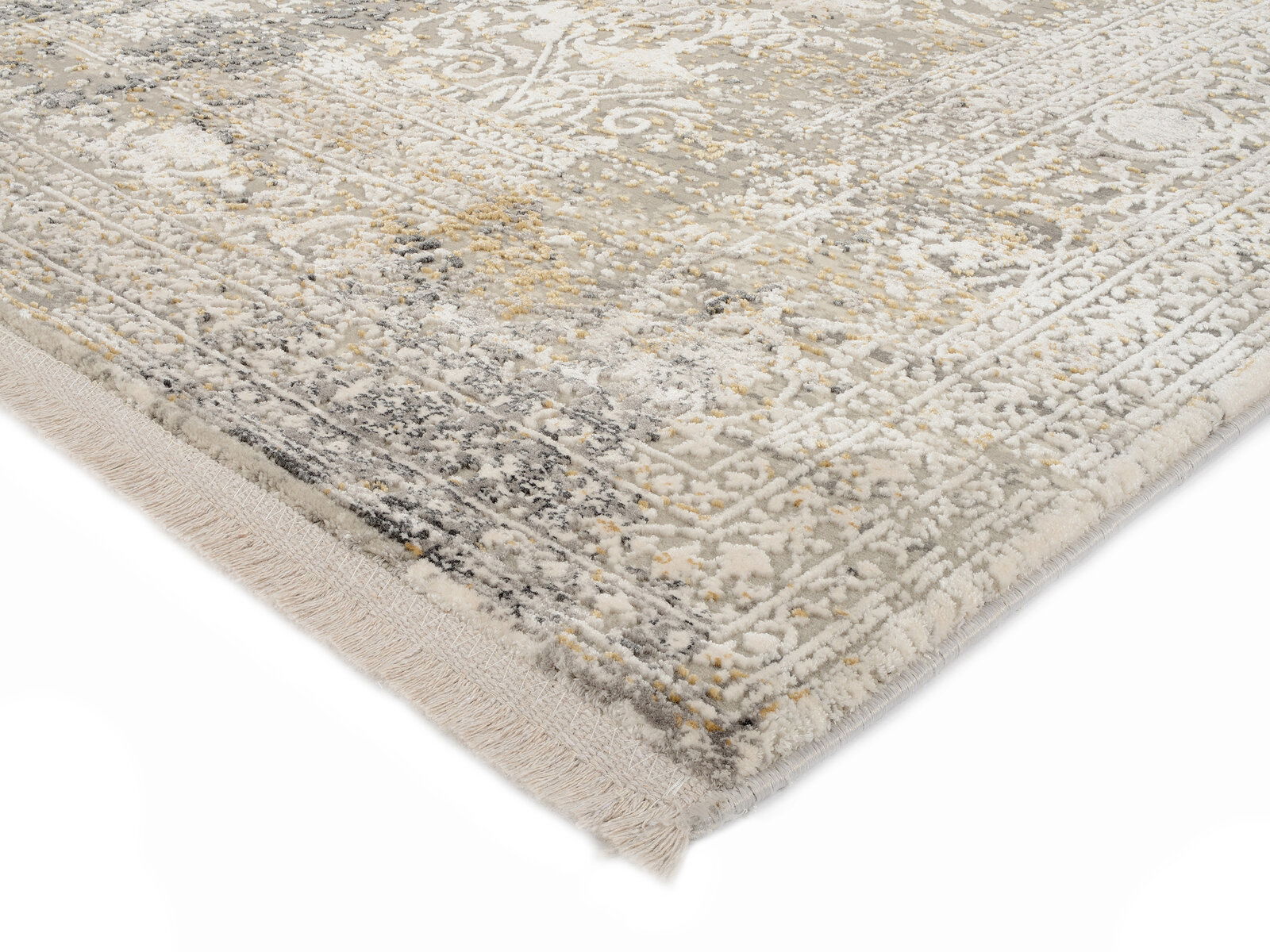 Nahaufnahme eines Designer-Teppichs mit detailliertem Muster in Grau- und Beigetönen, perspektivisch von der Ecke aufgenommen.