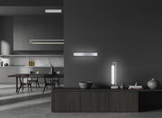 Moderne LED-Wandleuchte BOX in einem stilvollen, dunklen Interieur, seitliche Perspektive