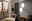 Zwei runde LED-Deckenleuchten ROVITO-Z an einer Wand in einem modern eingerichteten Flur, seitliche Perspektive.